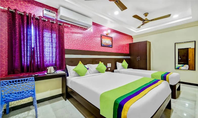Standard AC room with comfortable beds at Padmavathi Nilyam Tirumala